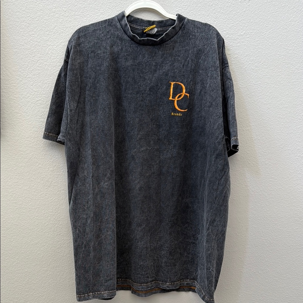 DC Dark Gray Tee with Vibrant Orange Accents